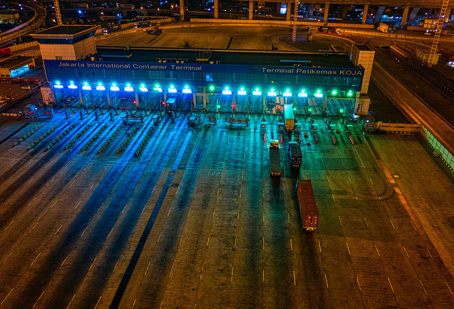 A low-light truck yard at night, representing the kind of isolated after-hours zone where remote verification matters most.
