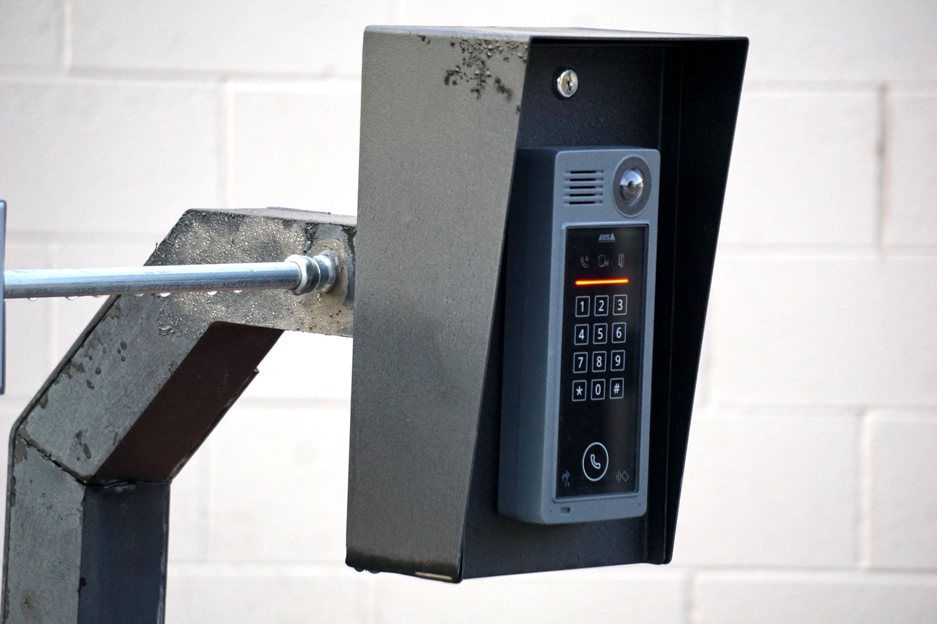 A secured industrial gate with keypad or access hardware that represents the fixed controls scrapyards should document first.
