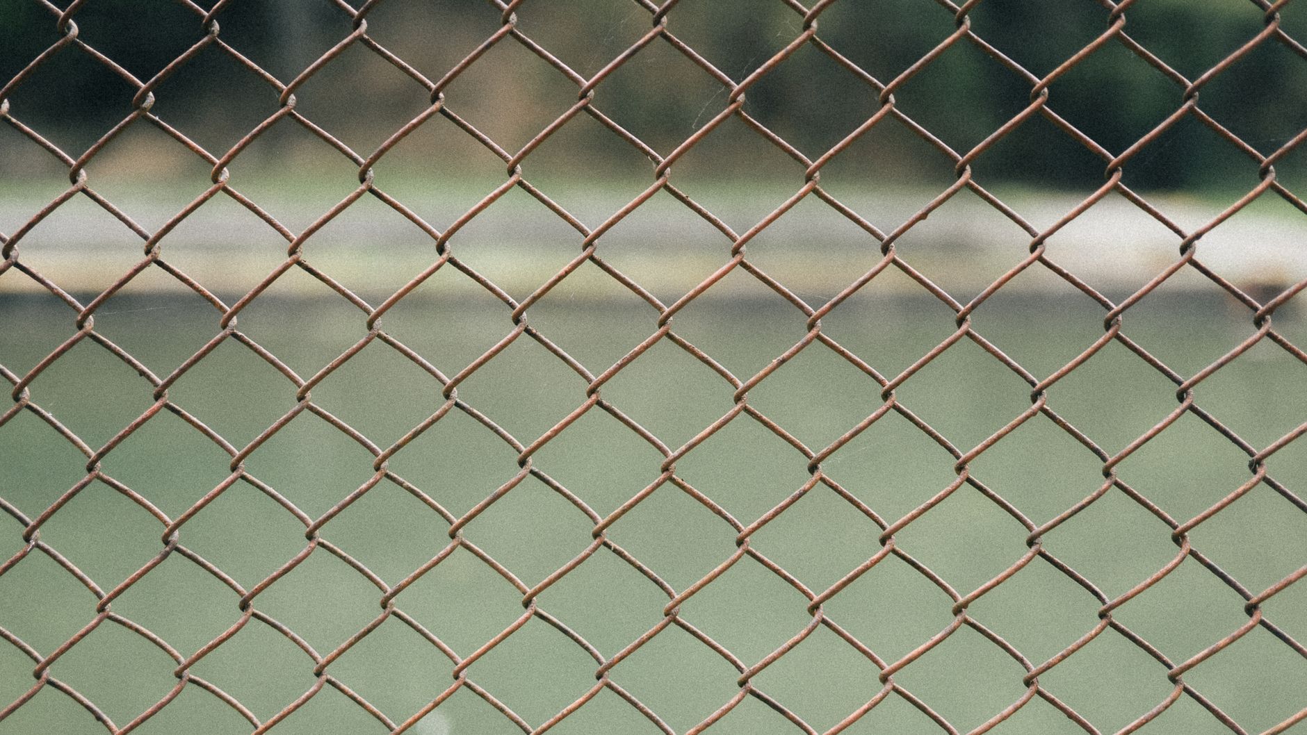 Perimeter fencing and yard lighting around an outdoor storage area, illustrating the conditions where night detection and verification matter most.