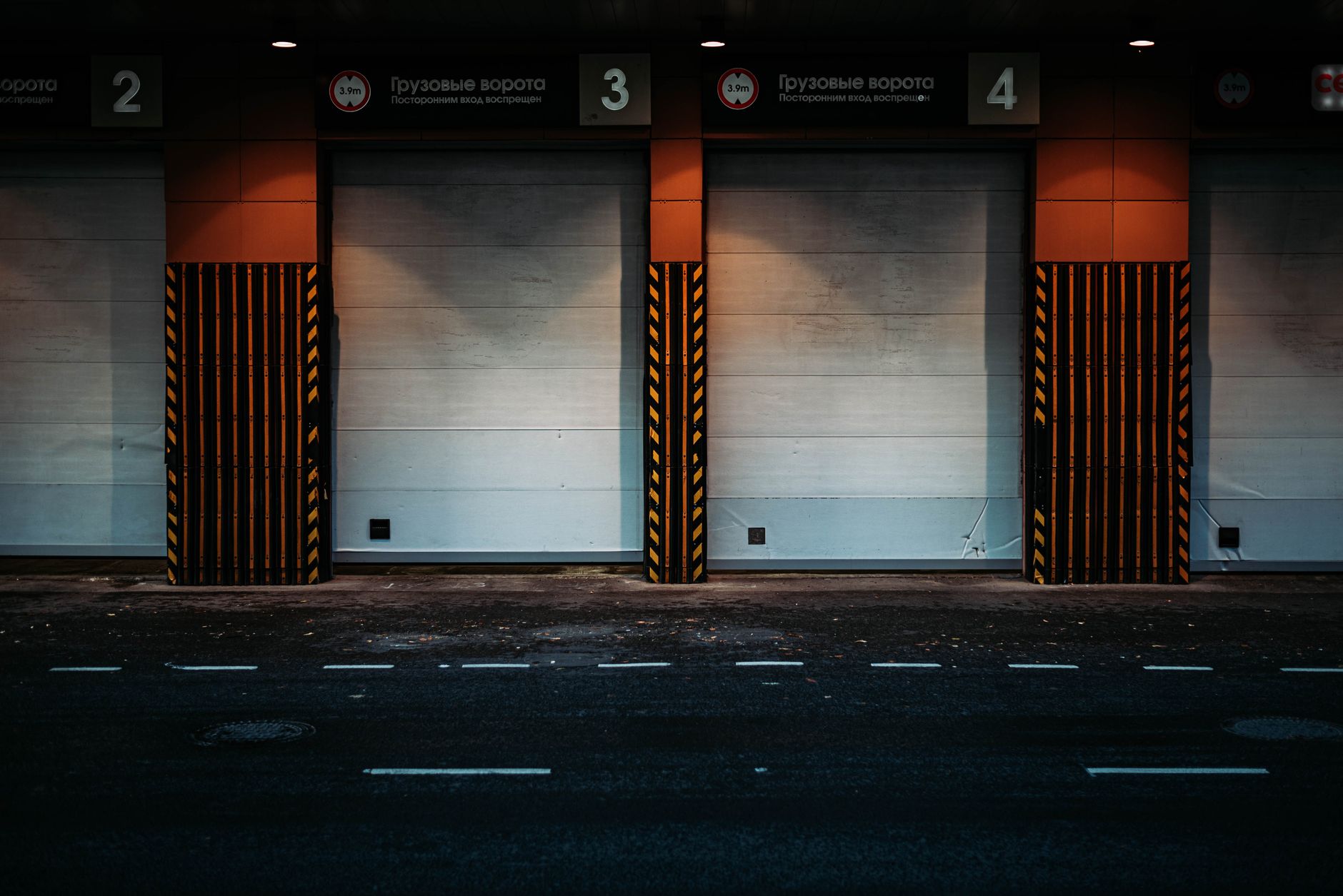 An open gate and service lane in an industrial yard, matching the article’s emphasis on checking gates, fire lanes, and parking discipline during patrols.