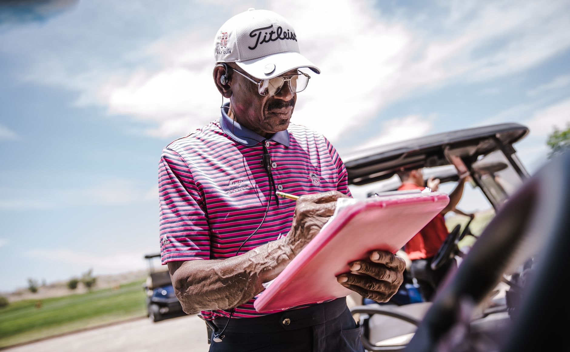Superintendent reviewing a hold calendar before morning play.
