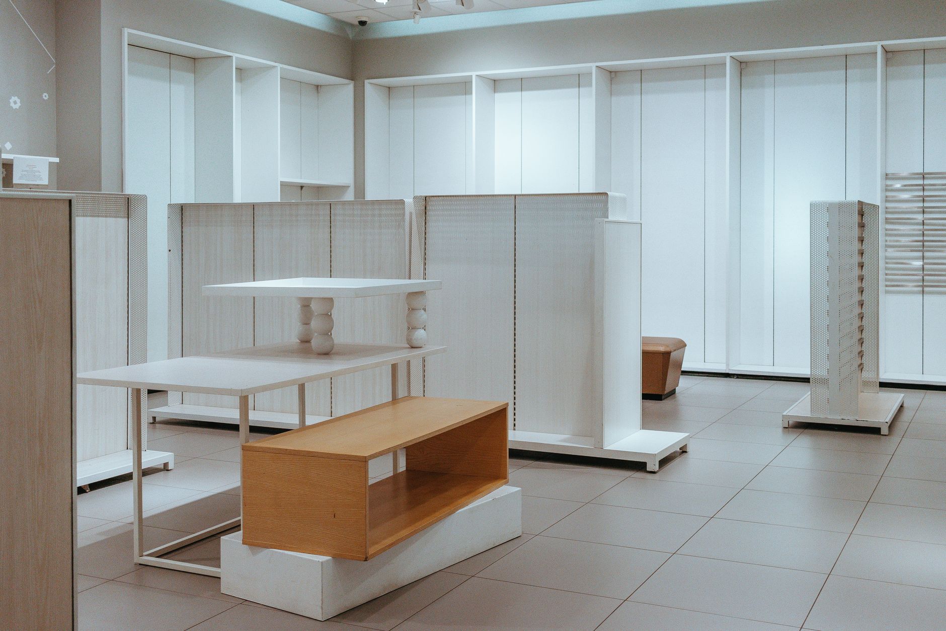 Shelving and boxed supplies in a back-of-house storage room, representing the kind of repeatable internal transport that fits support workflows better.