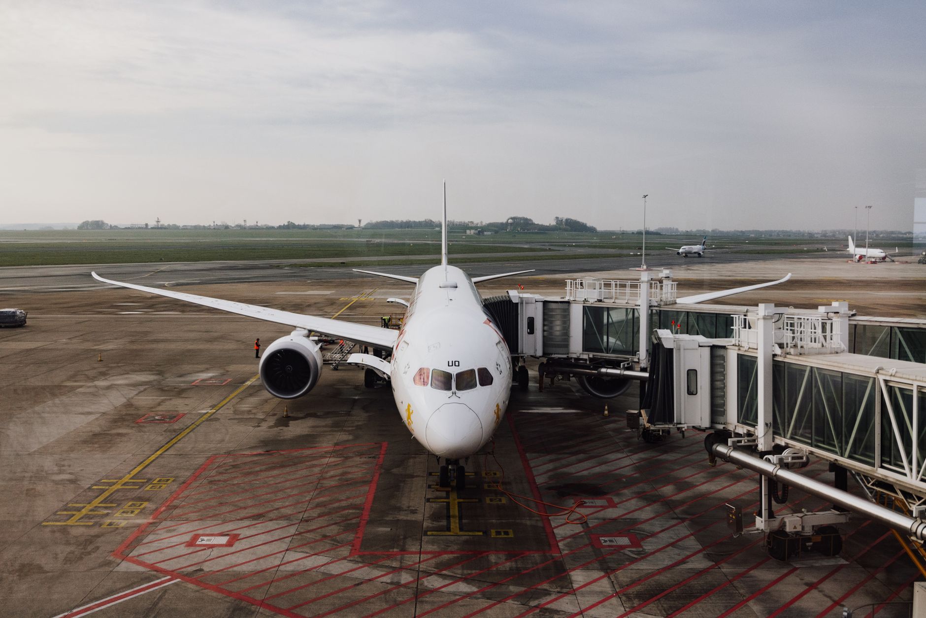 A jet bridge positioned at an airport gate, showing the kind of precise docking task that benefits from tightly controlled procedures.