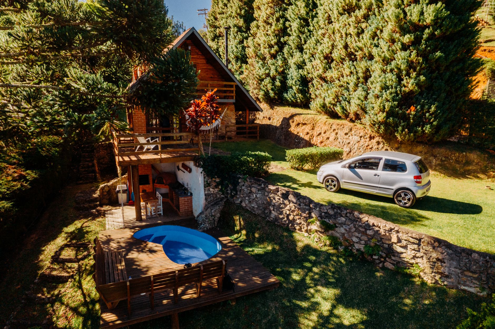 Outdoor approach to a rental property with uneven, weather-exposed access that makes broad autonomous service harder to run reliably.