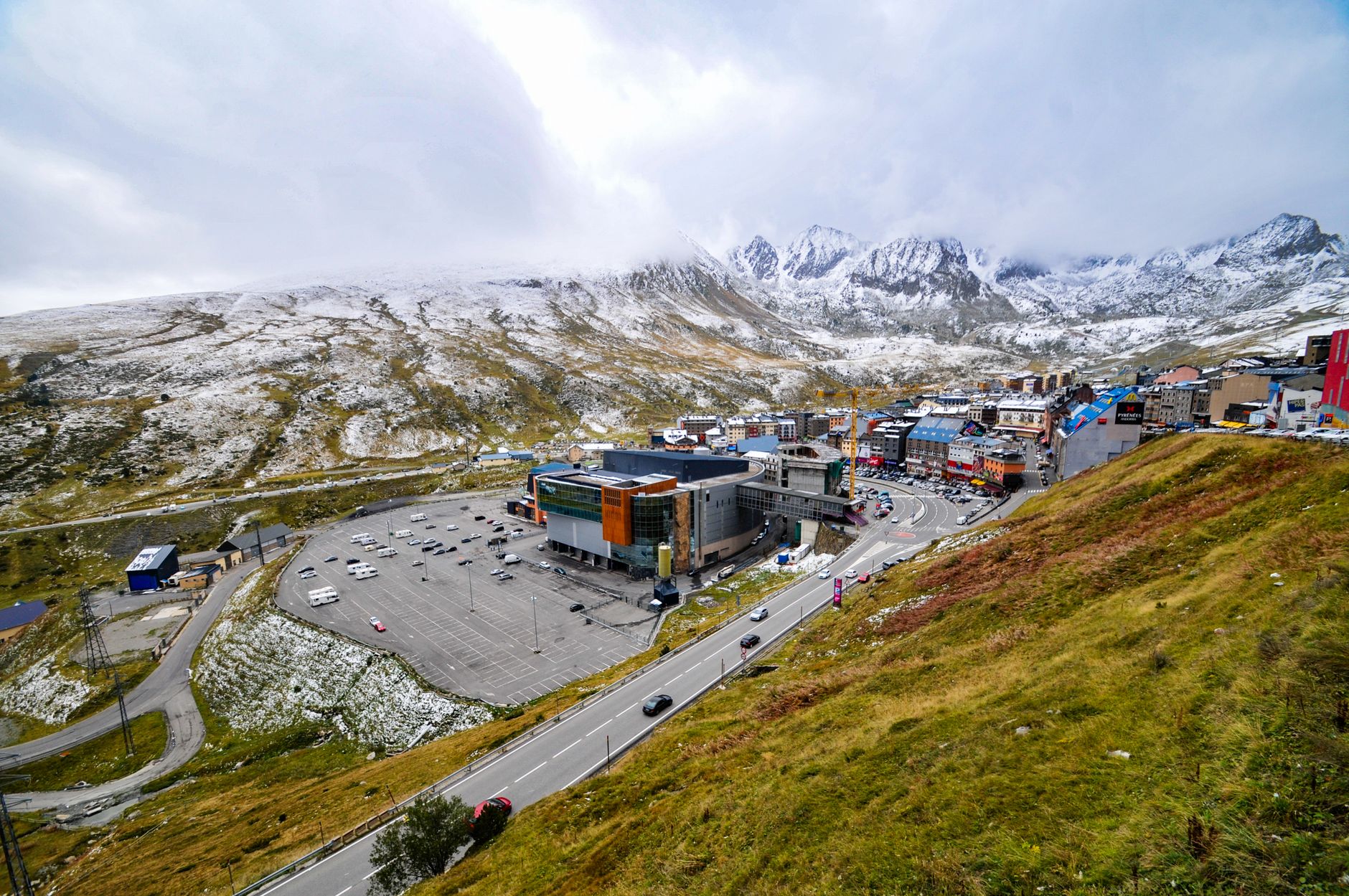 Retail storefront along a mountain highway in winter light
