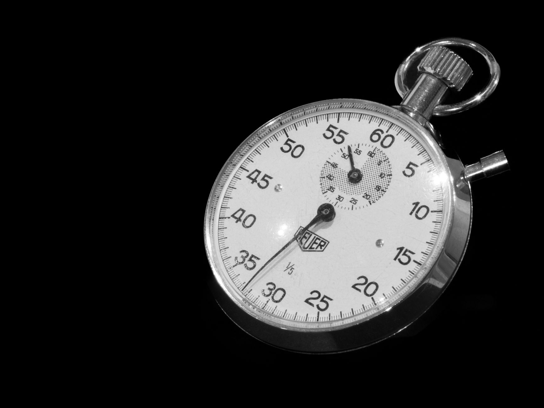 Clipboard with timing notes and a stopwatch on a desk, ready for a baseline log