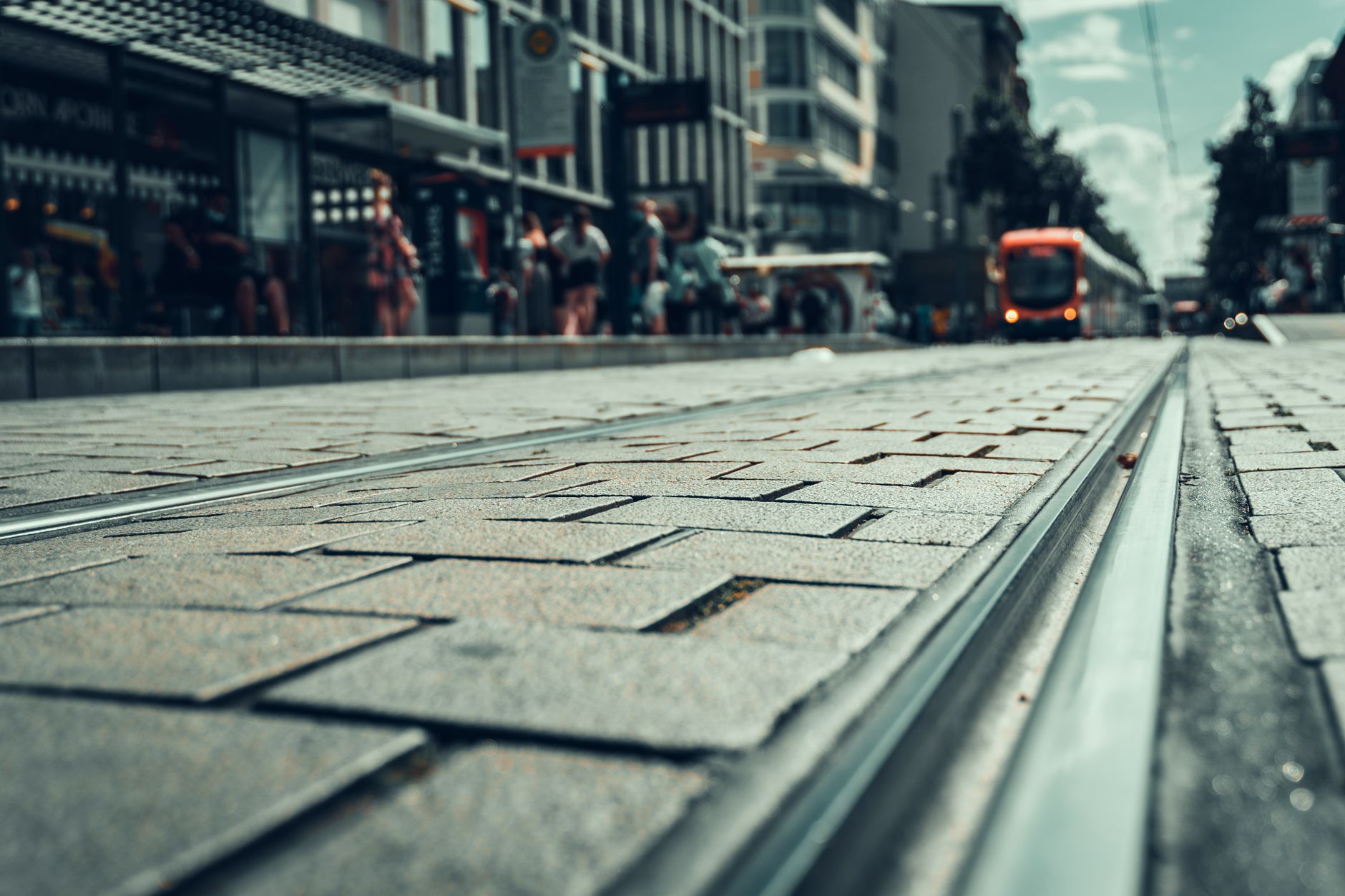 A close-up view of a city sidewalk, the primary environment for ground-based delivery robots.