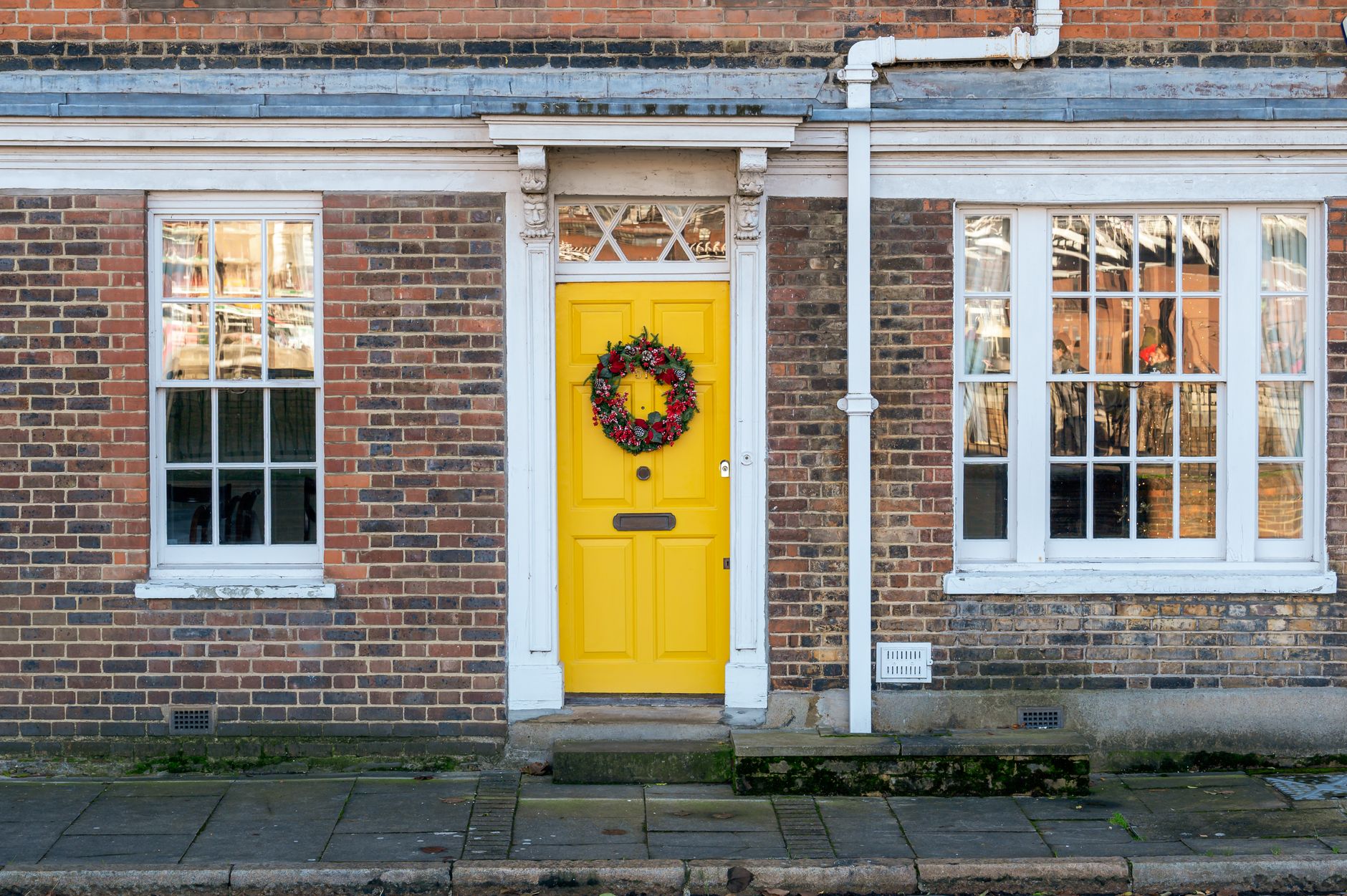 A welcoming front door of a home, representing the final destination for a last-mile delivery.