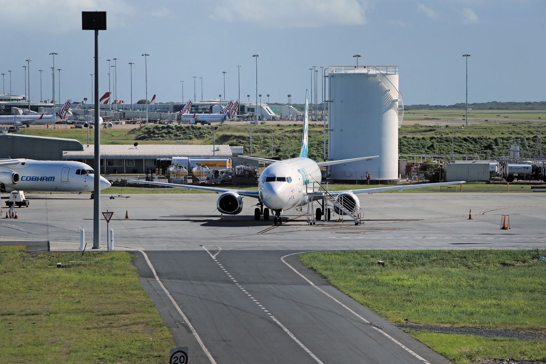 Aviation fuel storage and truck lanes that require explosion-aware patrol paths.