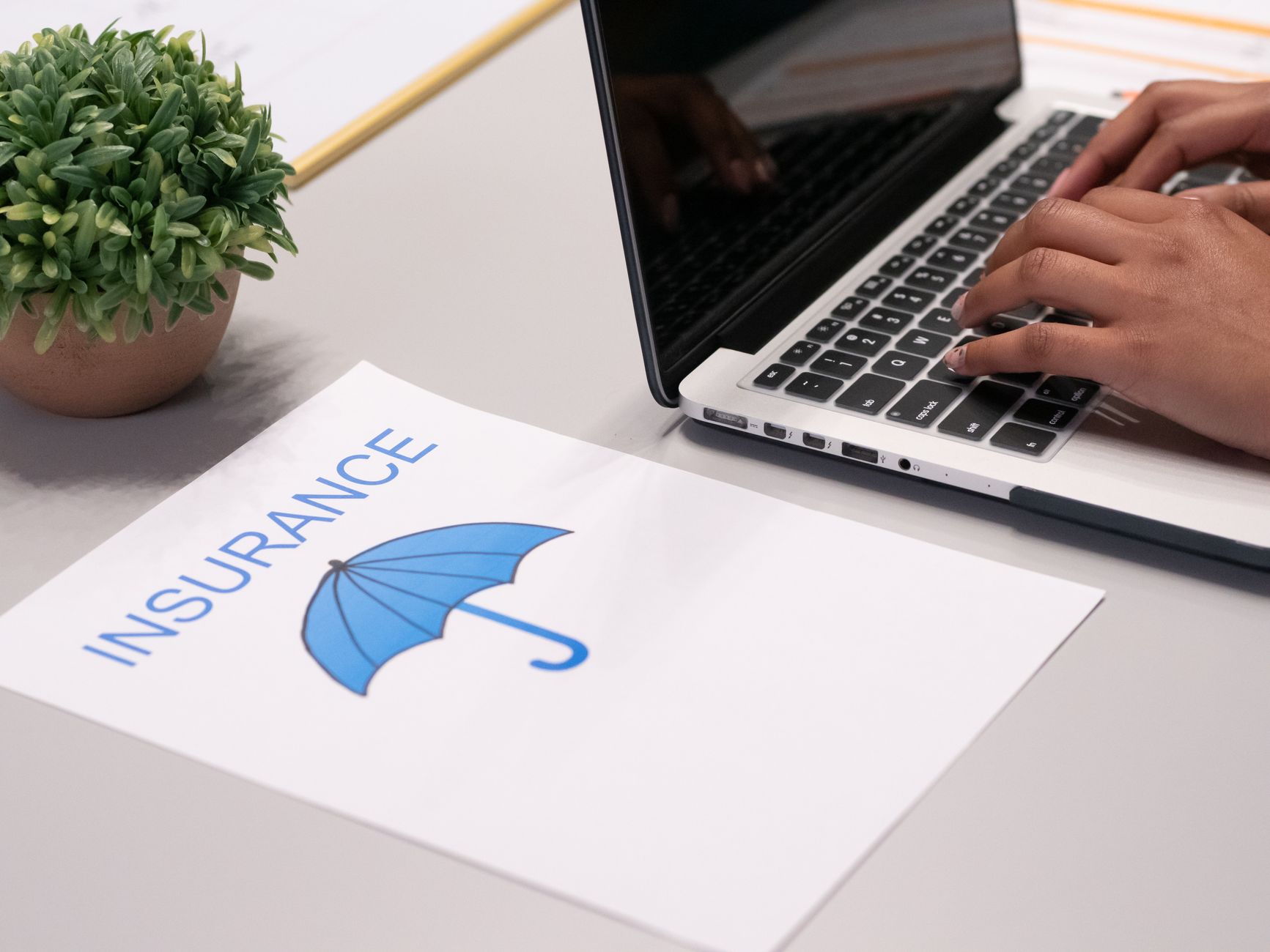 An insurance policy document is reviewed on a desk, representing the process of balancing robot deployment costs and benefits.