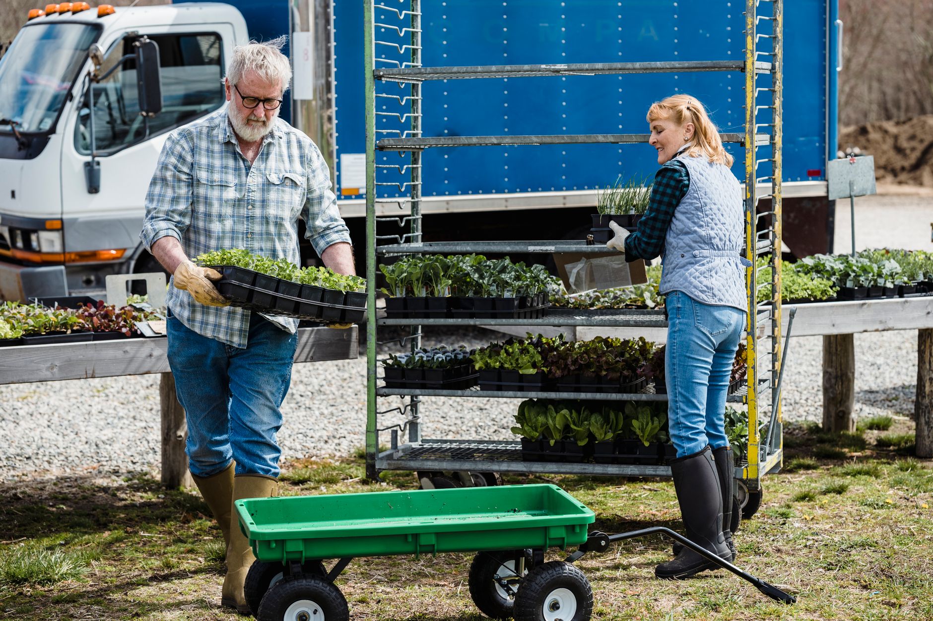 A staff member moving meal trays through a hospital underscores the kind of repetitive, low-complexity run that is easiest to automate first.