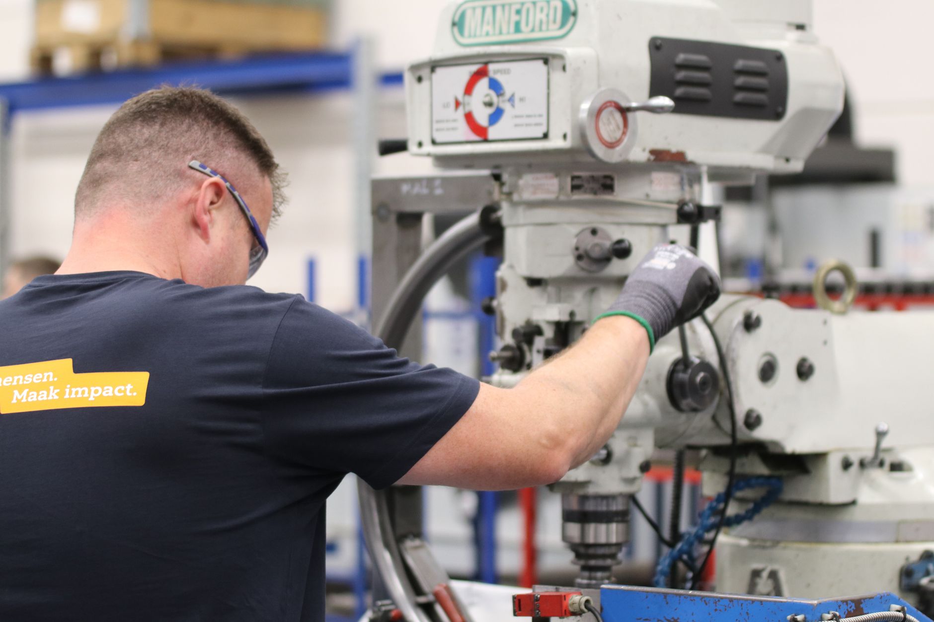 A machinist carefully setting up a fixture before the next production run.