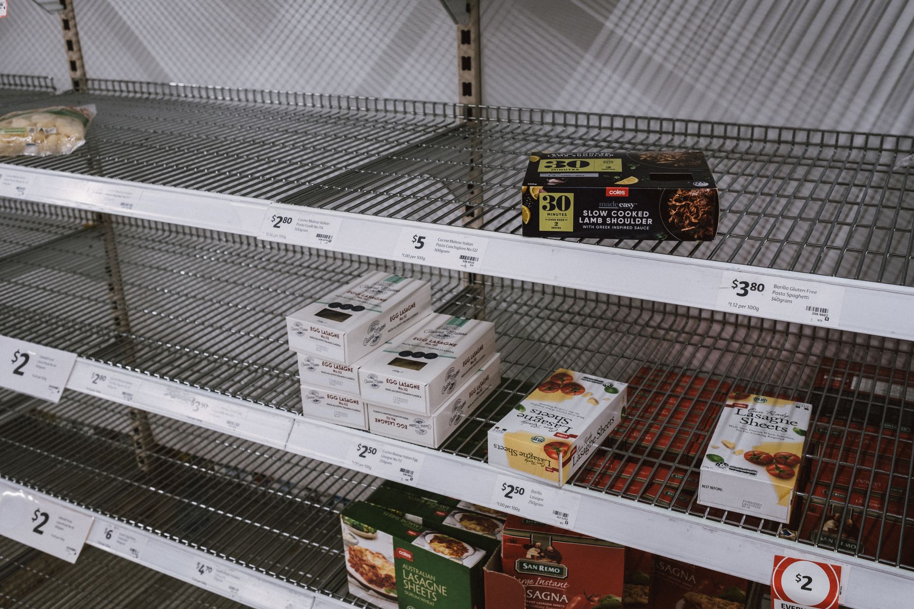 Newly launched packaged products are arranged on retail shelves.