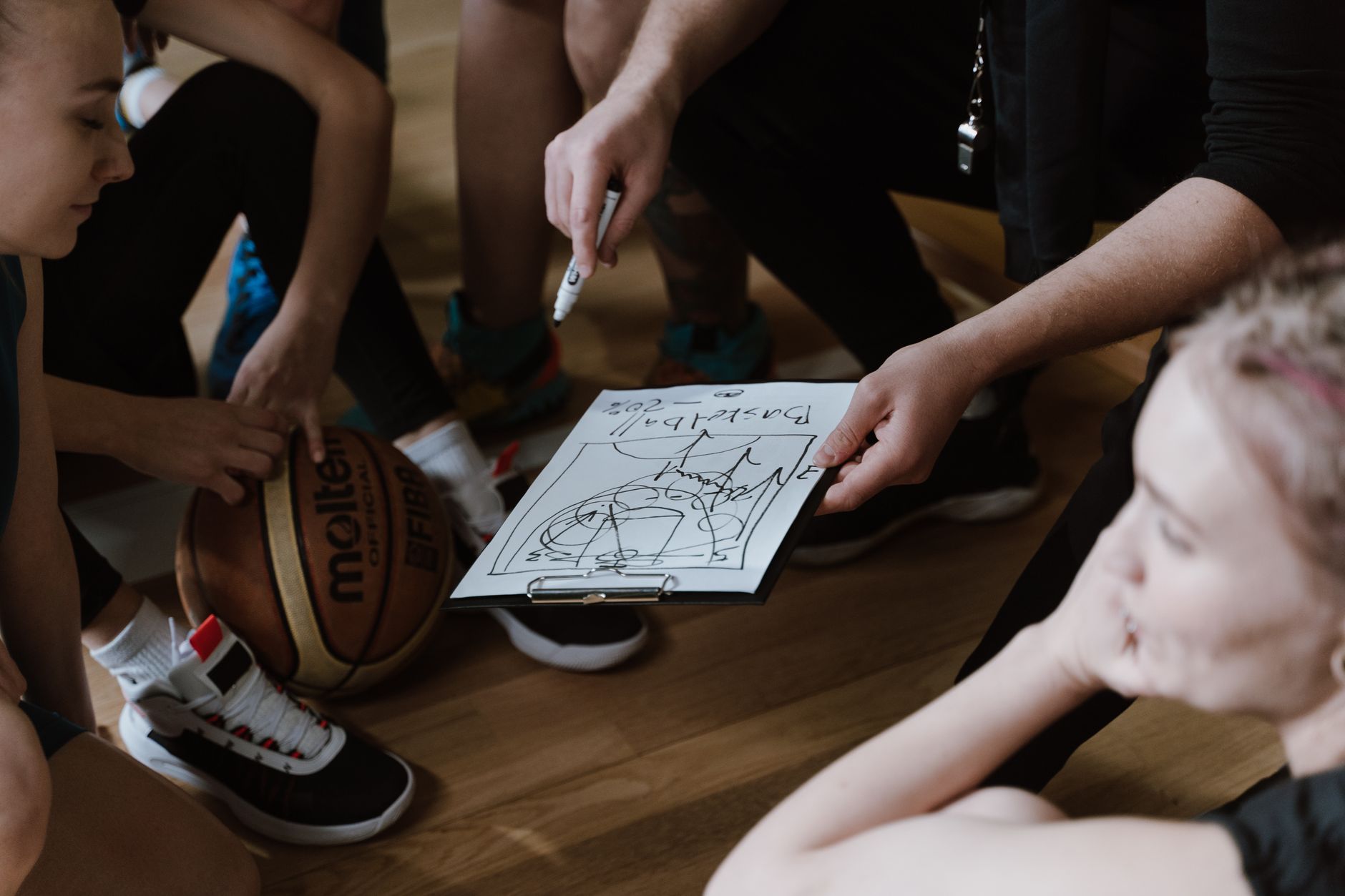 Staff reviewing a setup plan on a clipboard