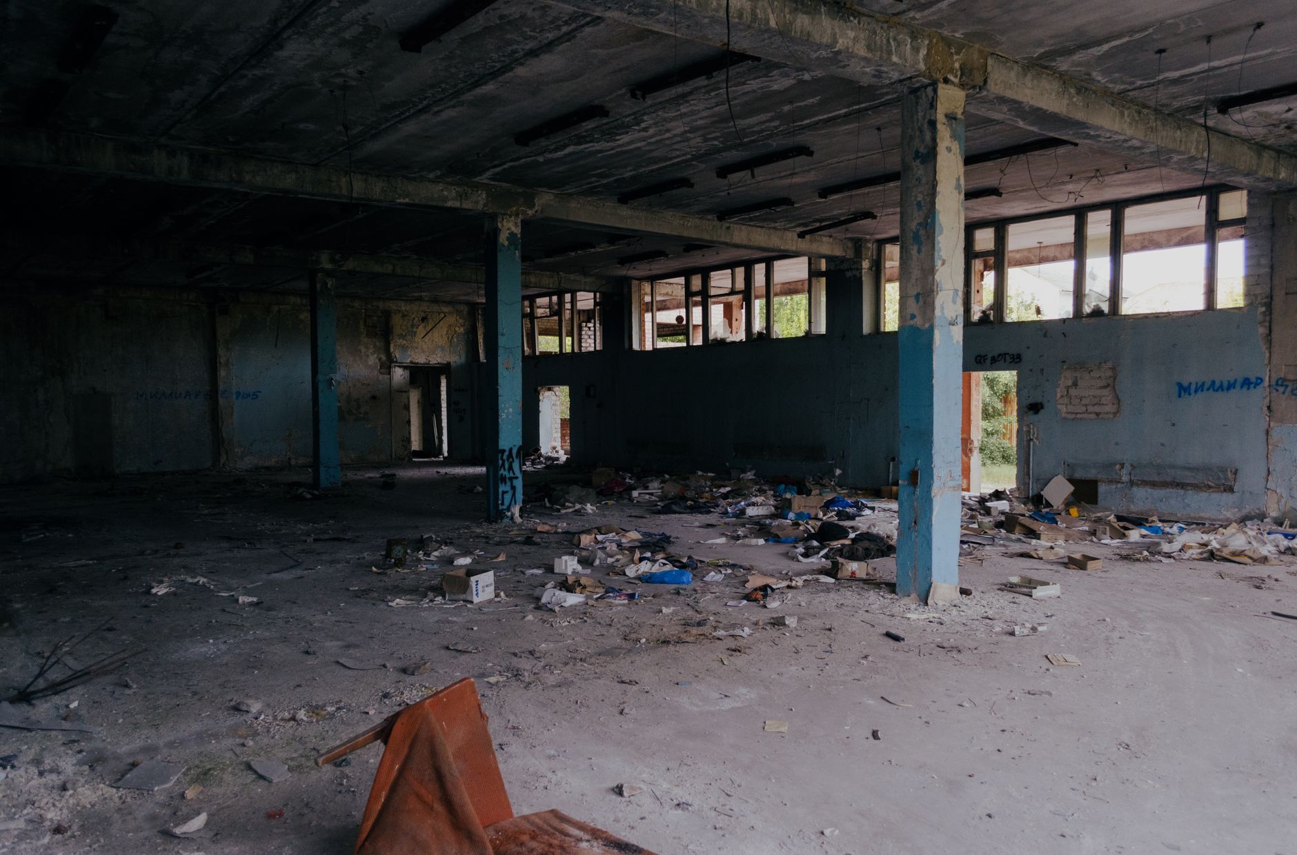 Dust near an open loading door at a rural supply building
