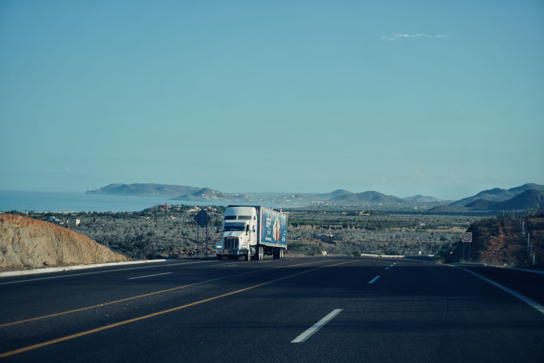 Semi truck on a rural highway suggesting freight traffic