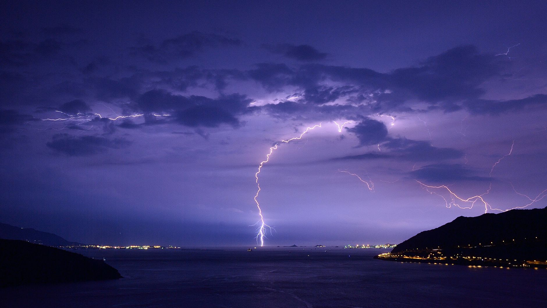Lightning on the horizon illustrates why outdoor robot fleets should stop when thunder is audible.