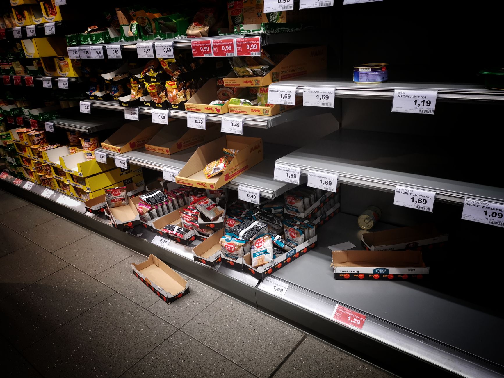 Supermarket aisle with fluorescent lighting
