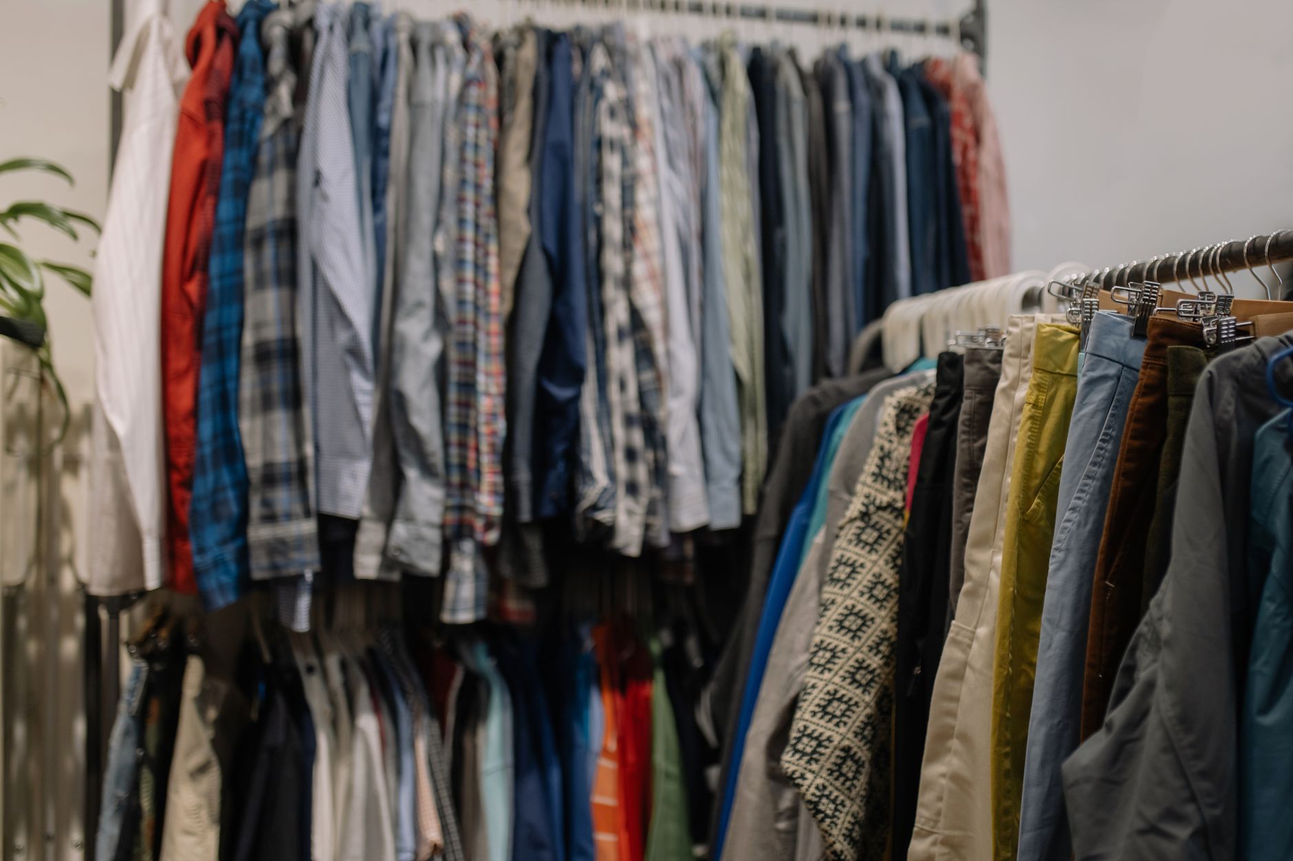 Interior of a thrift store with clothing racks and wide aisles