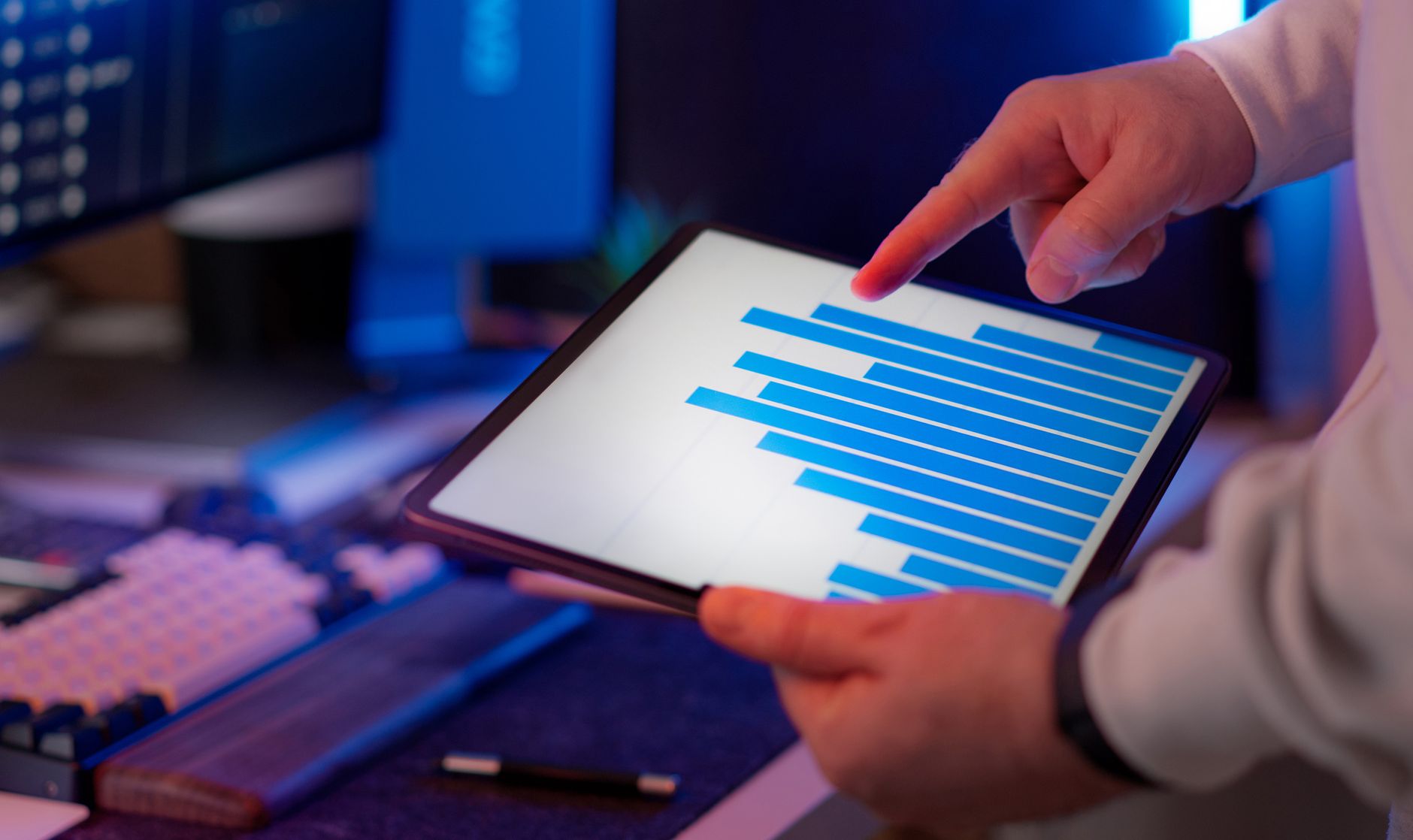 Facilities manager reviewing operational data on a tablet