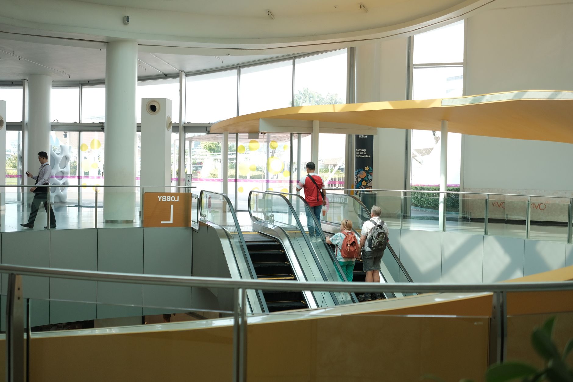 Wide view of a busy community recreation center interior that fits a YMCA-style facility where cleaning routes move through halls, fitness edges, and shared spaces.