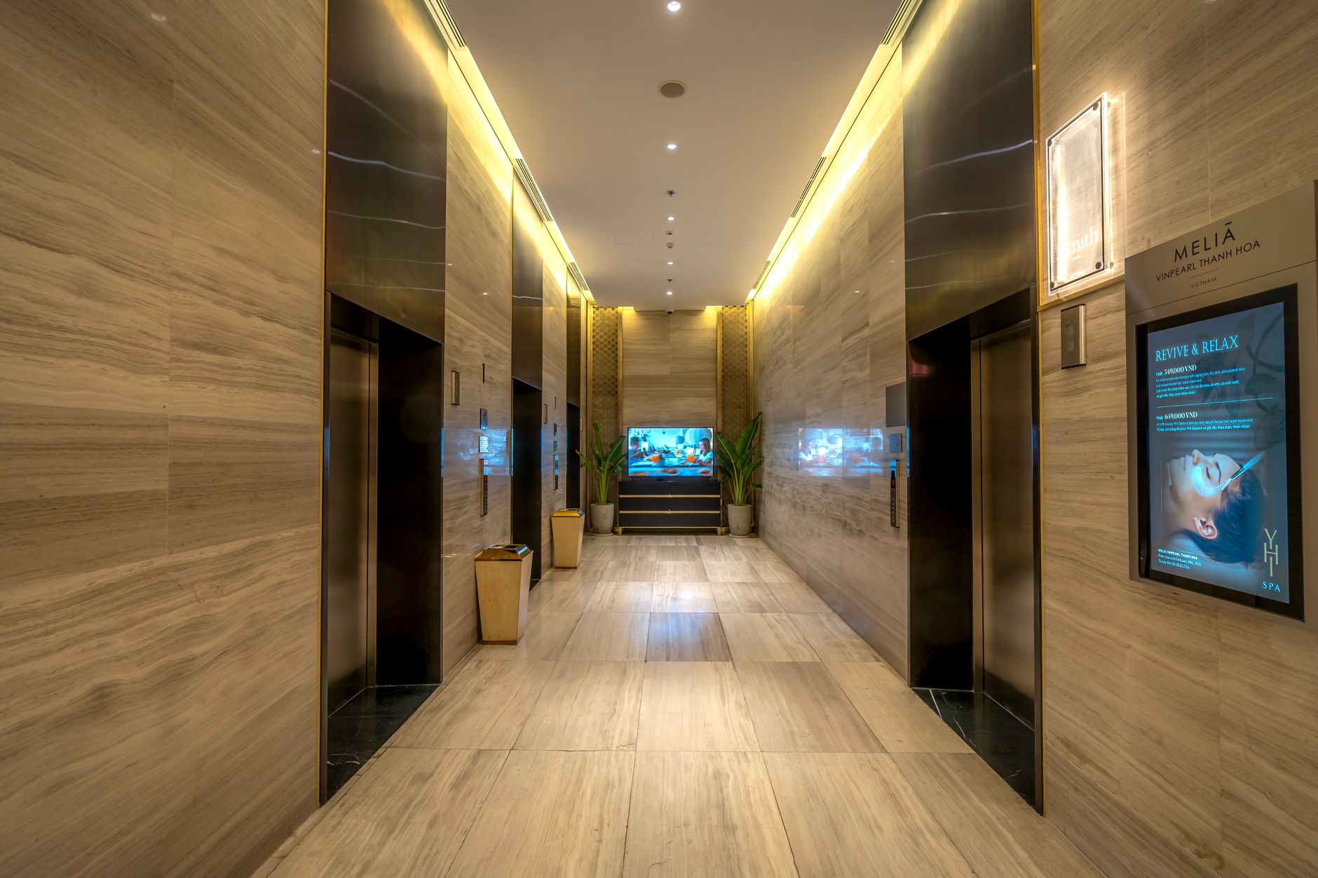 Hospital elevator area with clinical traffic, showing the kind of choke point where exceptions and delays complicate transport automation.