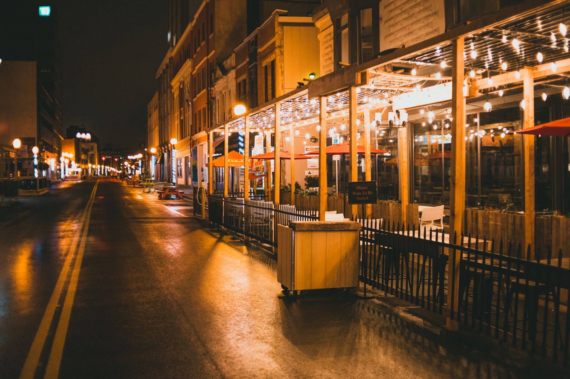 Urban sidewalk near restaurant storefronts
