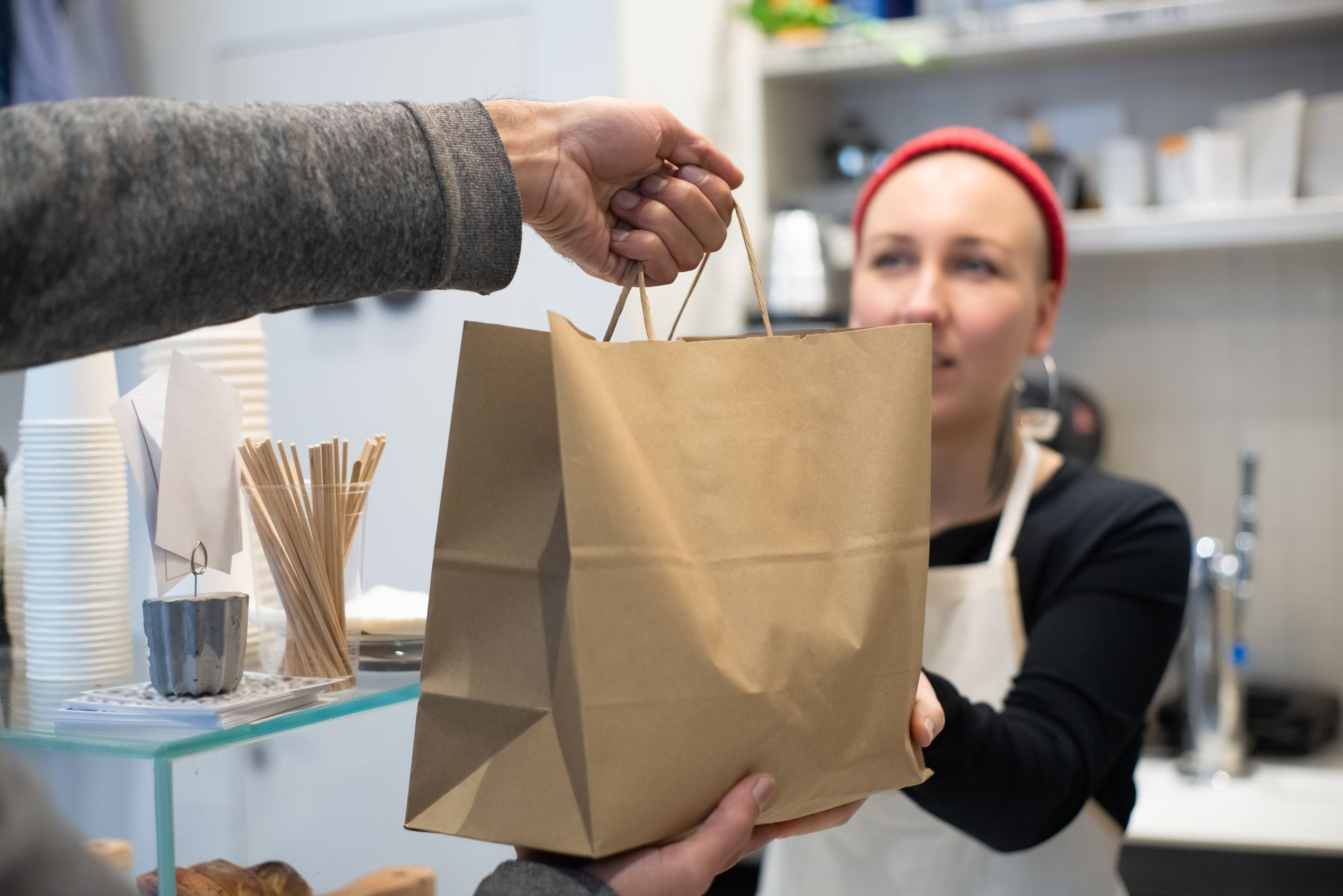 Restaurant takeout bags ready on a service counter