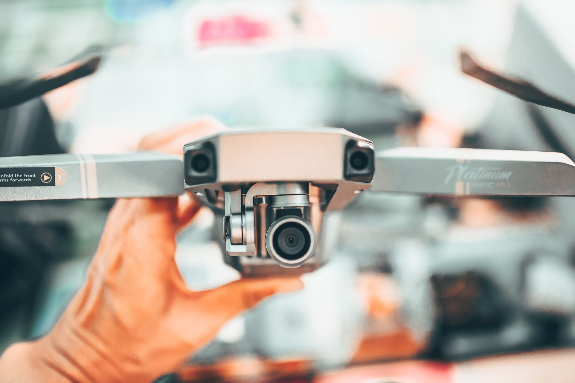 A technician uses a thermal camera to check industrial equipment for abnormal heat.