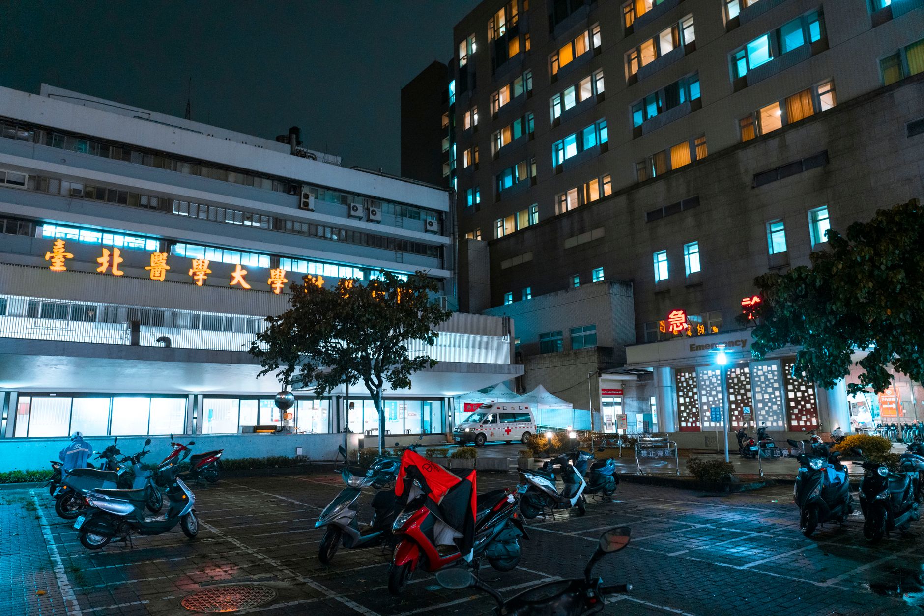 Emergency department corridor with clinical lighting and treatment bays