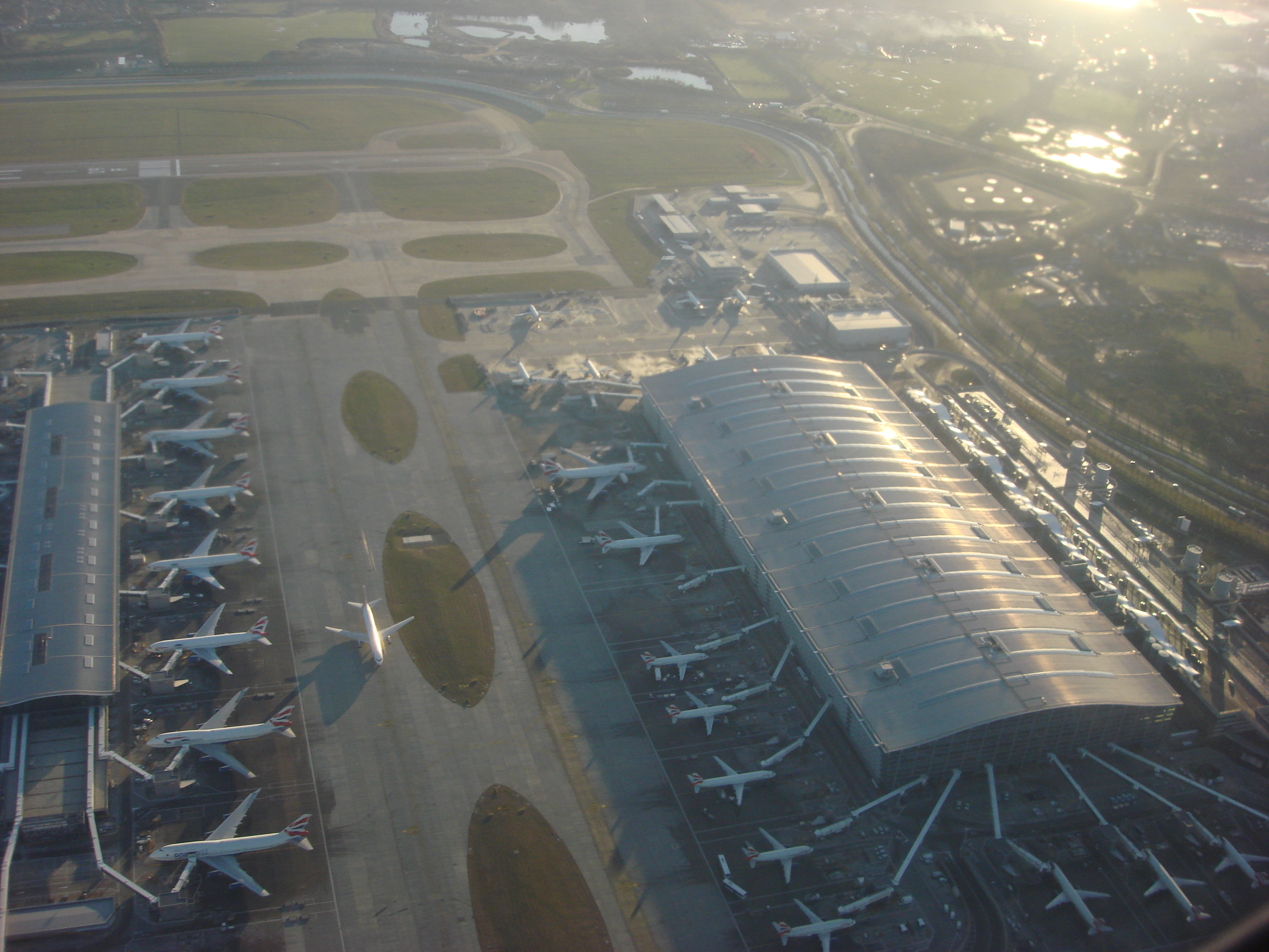 Exterior view of Heathrow Airport terminals and apron activity, setting the scene for a story about airport cleaning operations at scale.