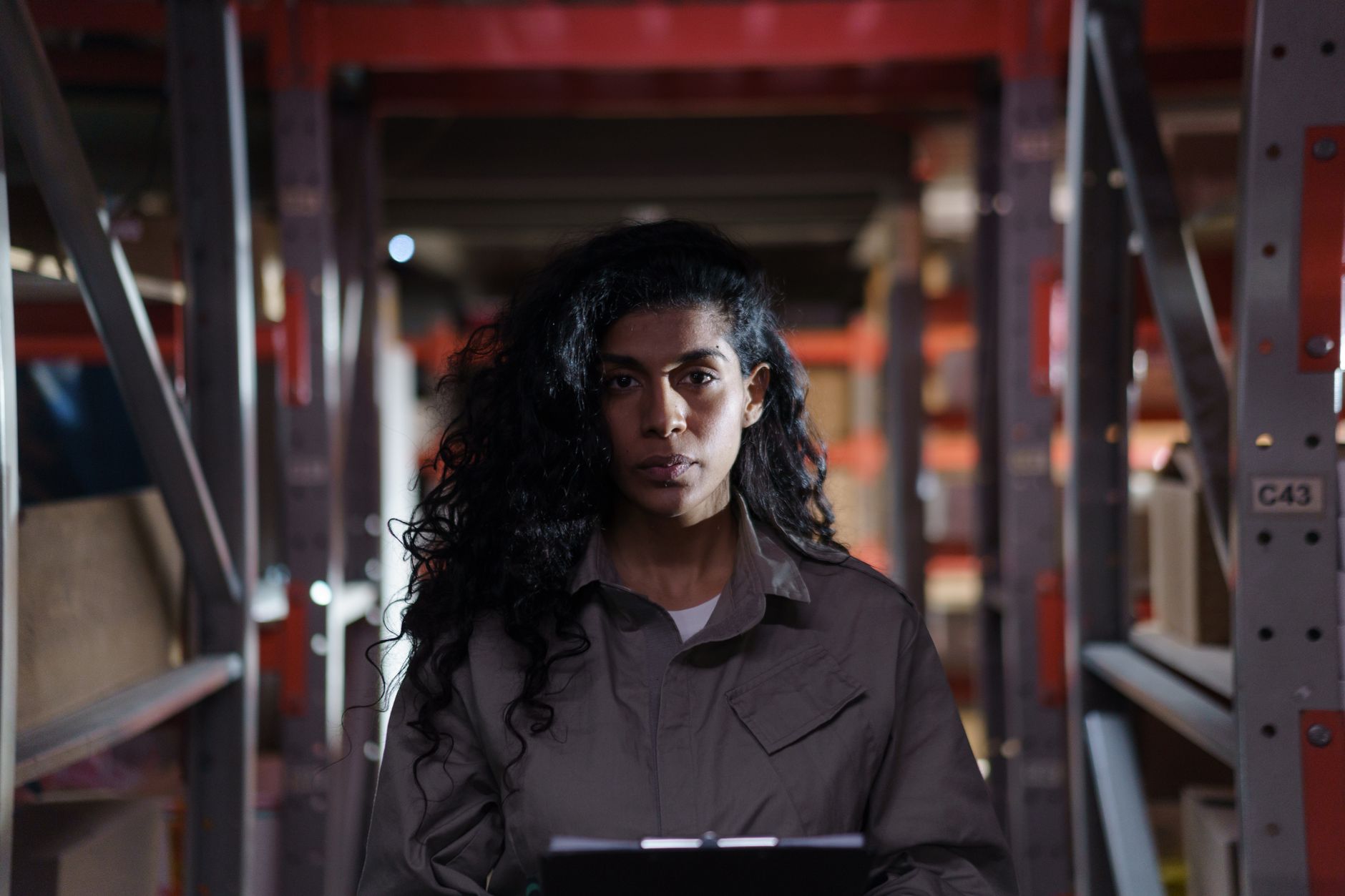 A supervisor reviews site details in a wide commercial aisle, matching the article’s emphasis on disciplined pre-deployment surveys.