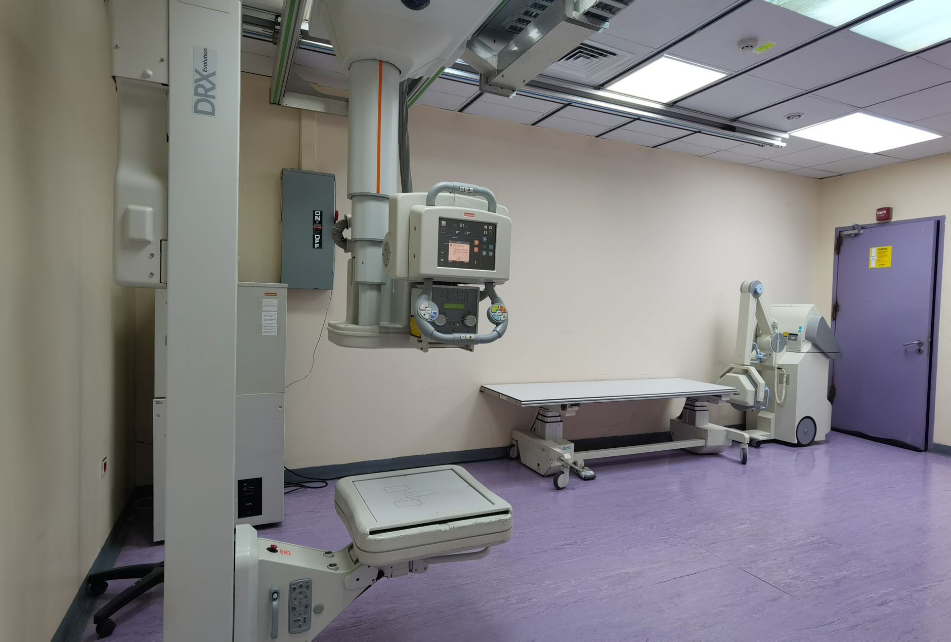 Hospital equipment staged in a clinical storage area, underscoring the uptime, access, and support realities that shape adoption.