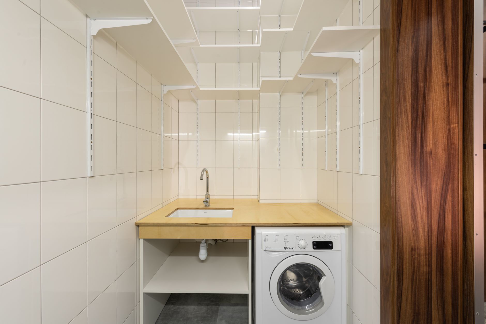 A back-of-house janitorial utility room with sink, storage, and supplies, showing the kind of charging, refill, and staging space a casino survey needs to verify.