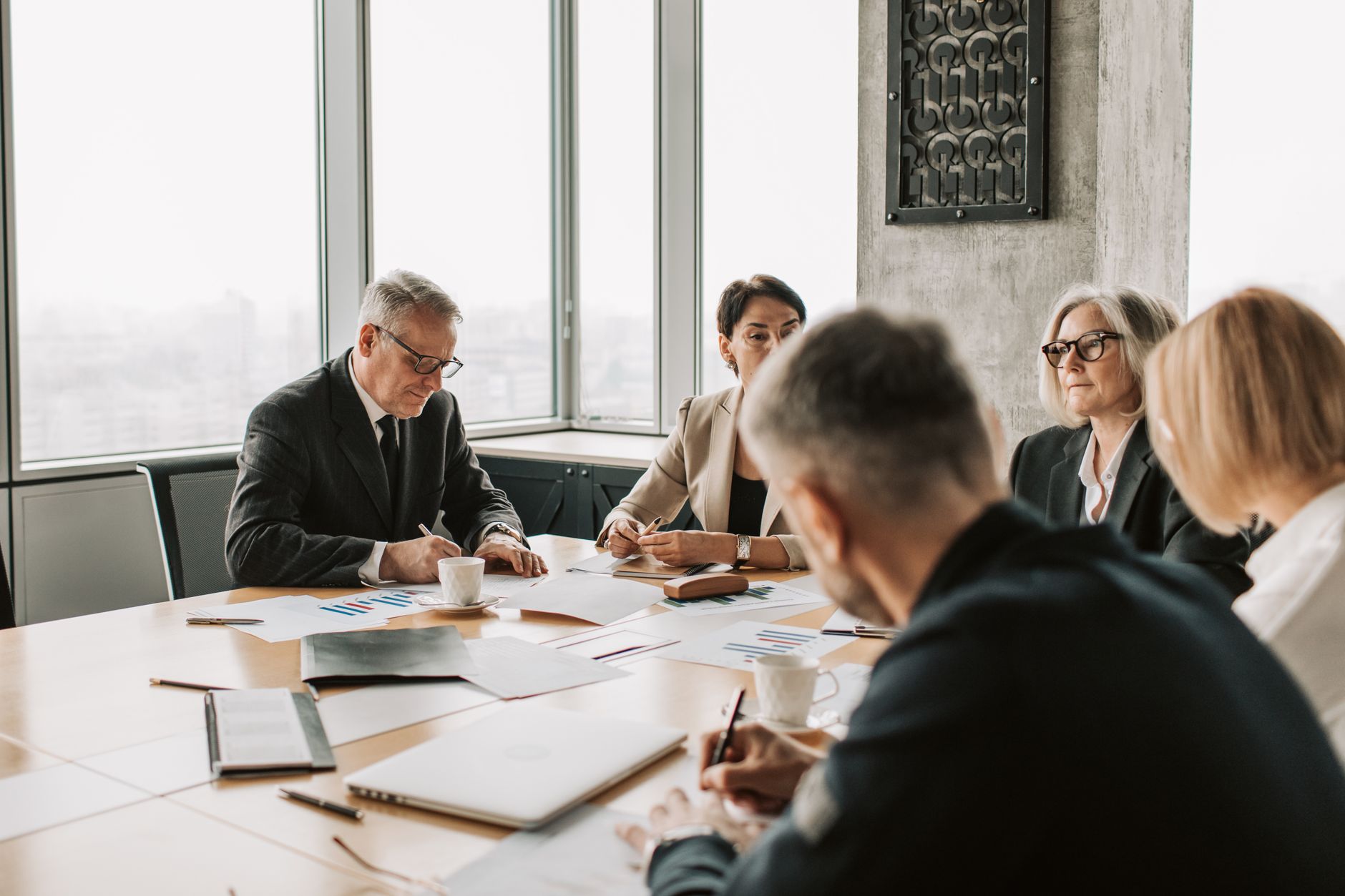Healthcare leaders meeting around a conference table