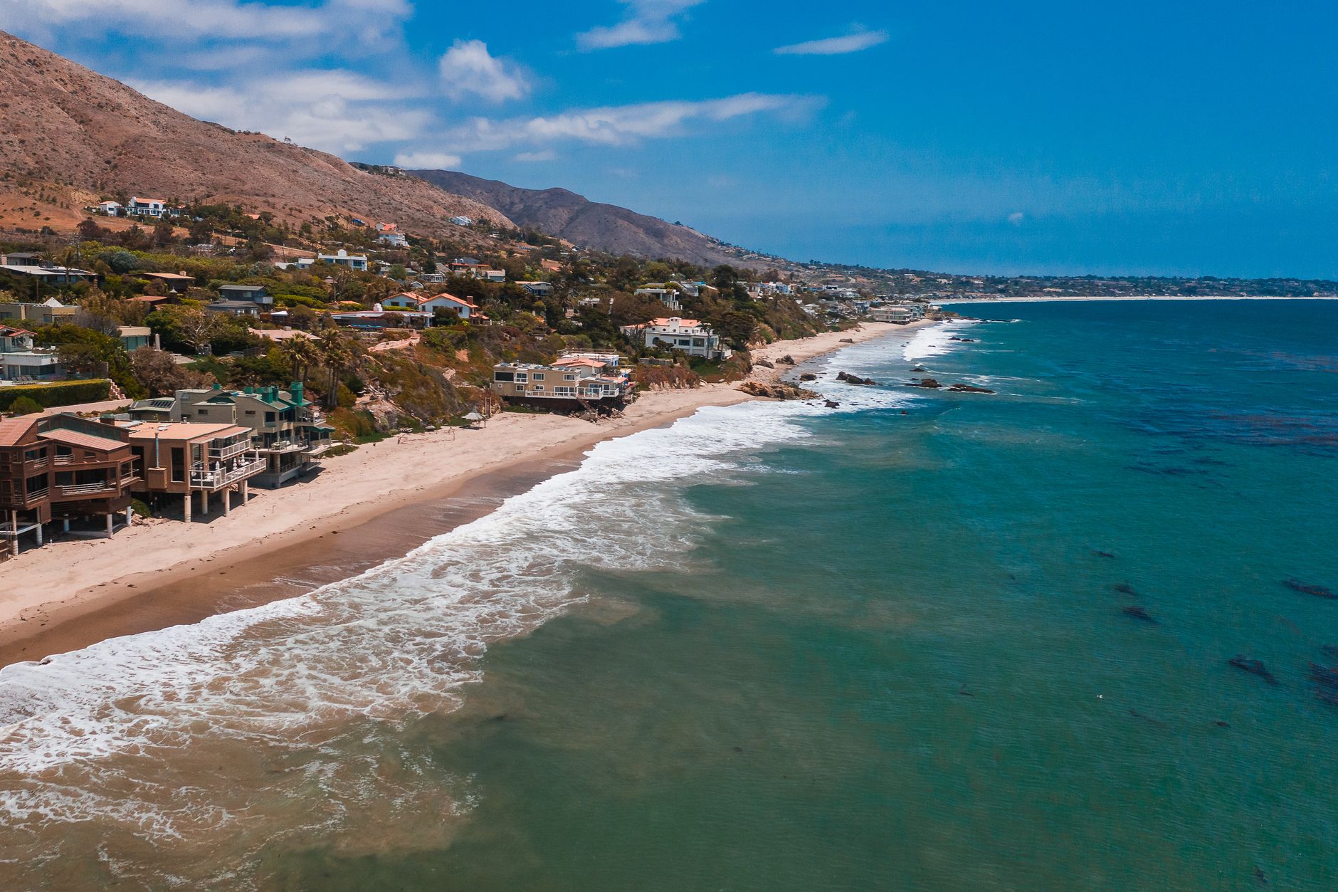 The Malibu coastline reflects the coastal venue context for a one-night robot sharing deployment.