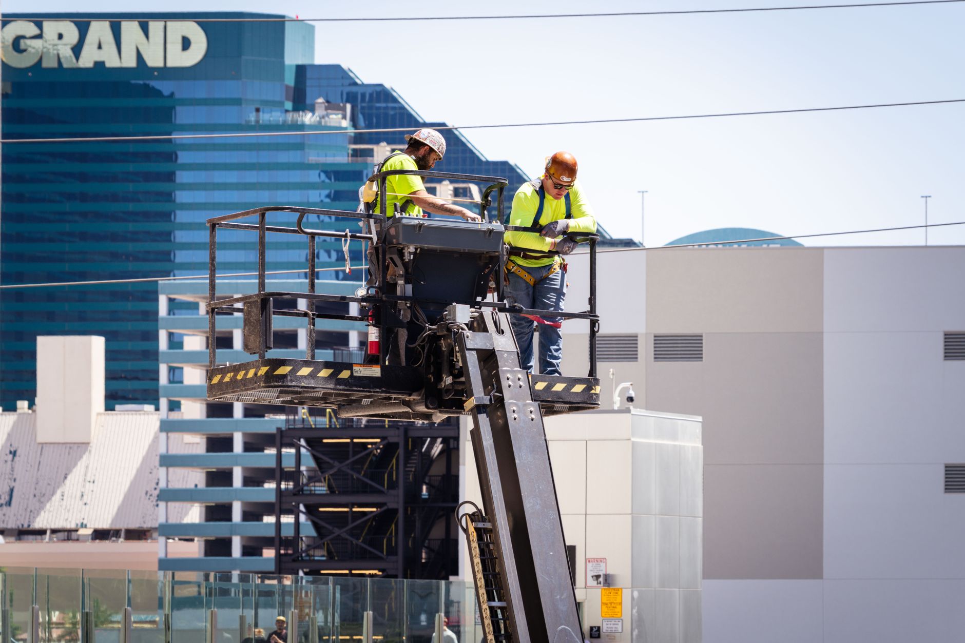 A hotel maintenance worker checking building equipment during a service interruption.
