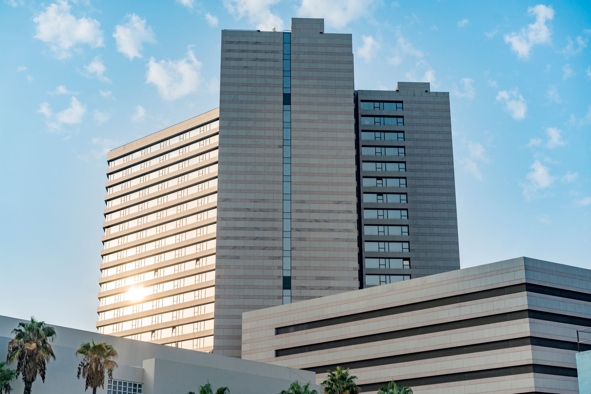 A multi-story hotel tower where elevator continuity is essential to guest delivery operations.