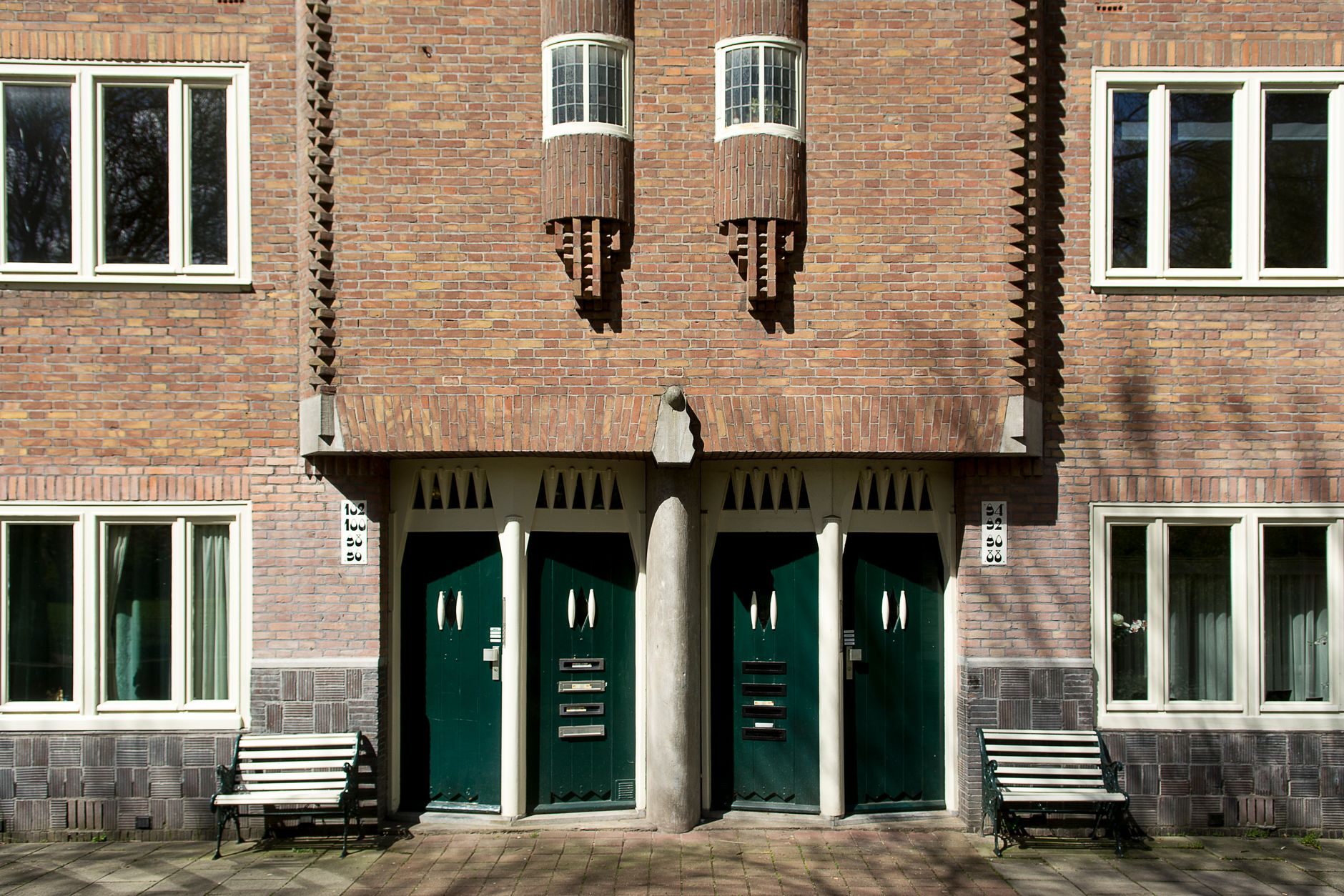 A school building entrance with clear doors and a supervised front approach, illustrating where fixed cameras and access control work best.