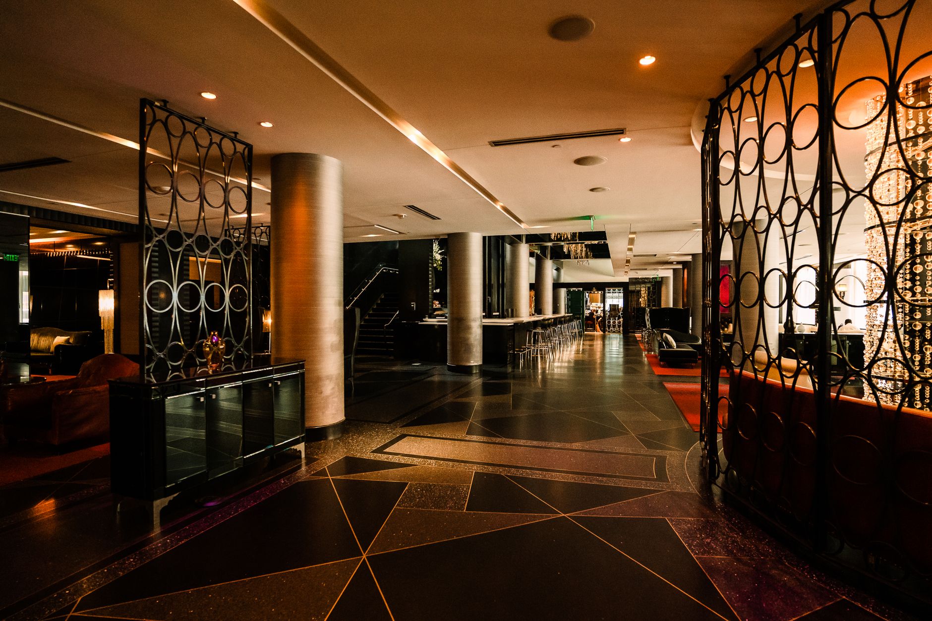 Upscale downtown hotel lobby with a polished front desk and guest seating, setting the scene for high-touch hotel service.