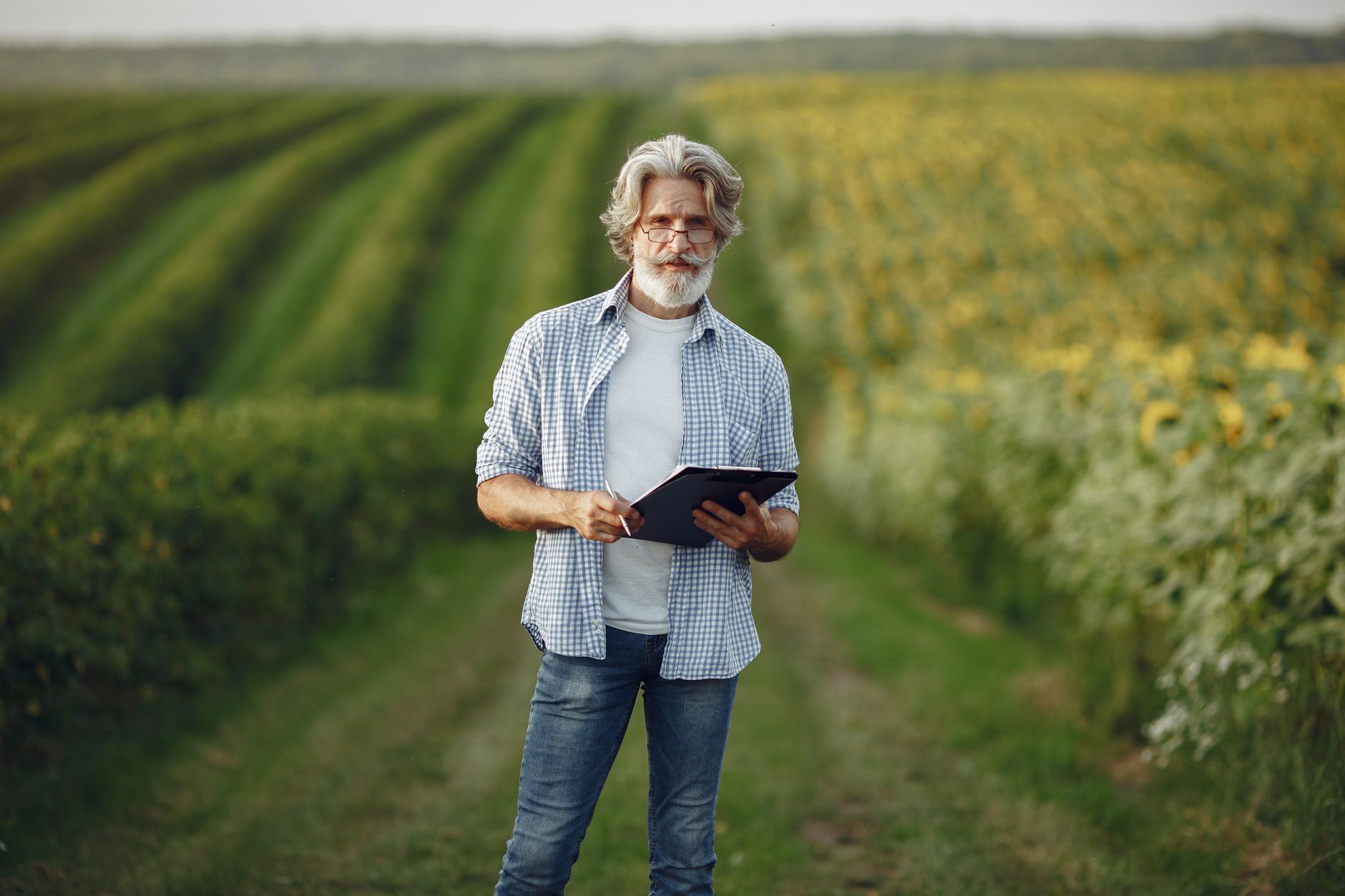 A grower monitoring field operations after autonomy frees time from the cab.