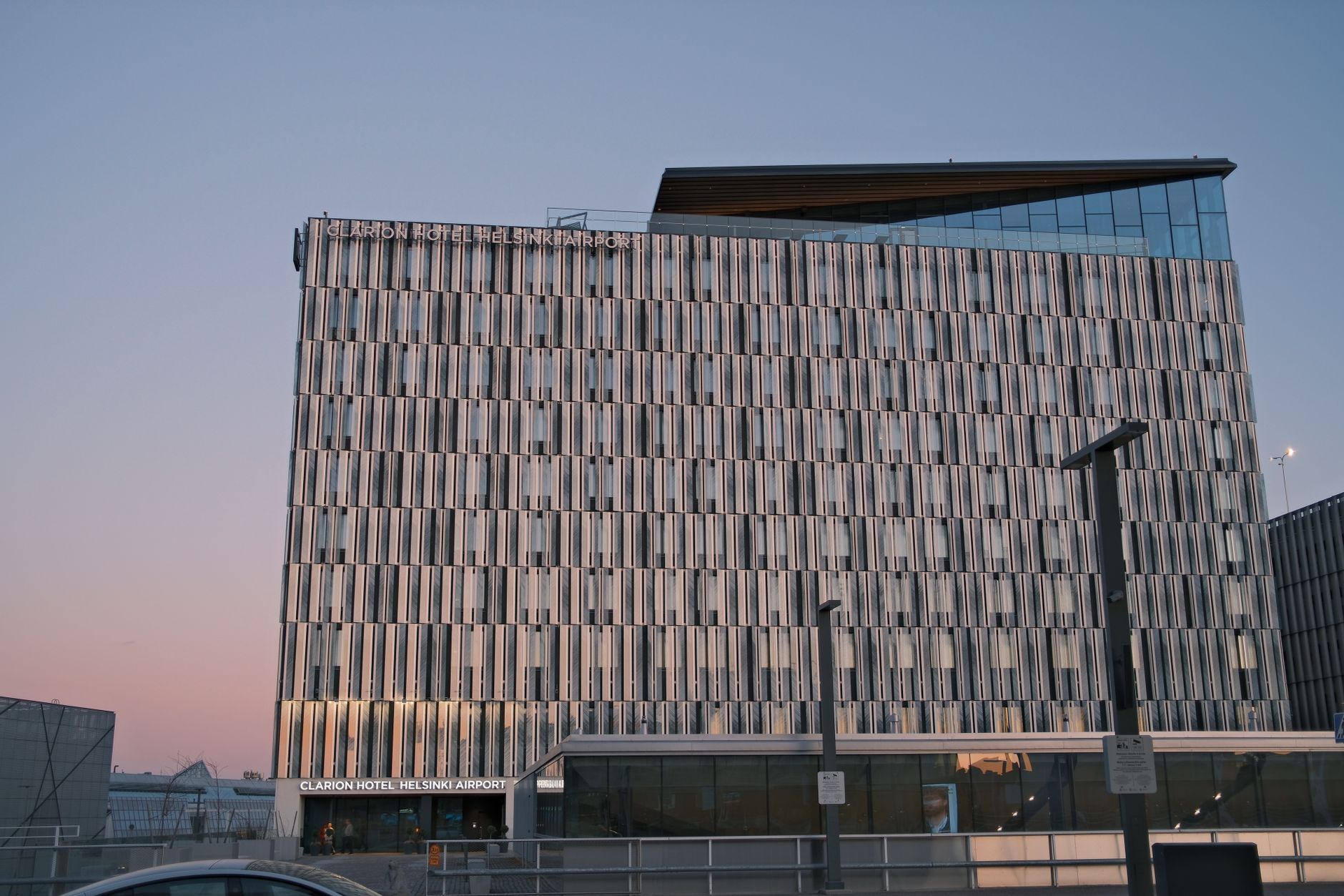 Exterior view of a modern airport hotel, matching the fast-turn hospitality setting in this case study.