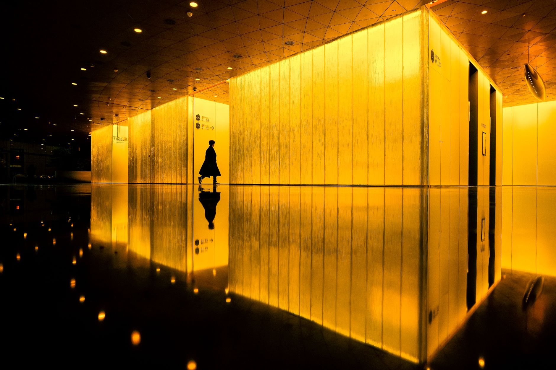 A quiet shared-office corridor illustrating the challenge of overseeing a facility after hours.