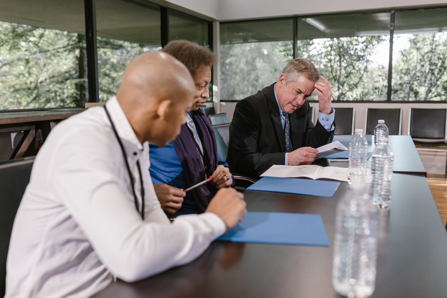 Hospital leaders in a planning meeting echo the article's lesson of shaping automation around care workflows and change management.