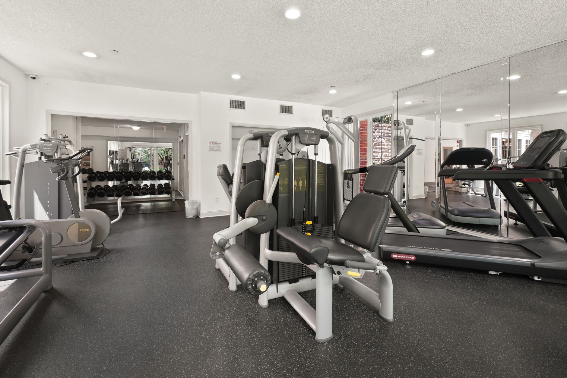 A clean apartment fitness center illustrating the resident-facing amenity included in the paired deployment.