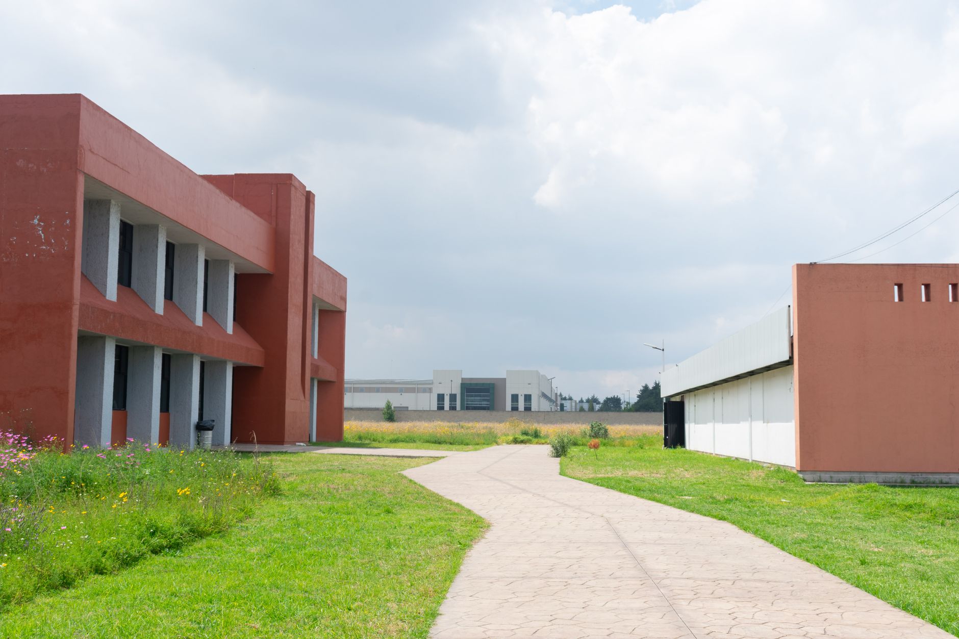 A large institutional campus at night where utility buildings need dependable floor care.