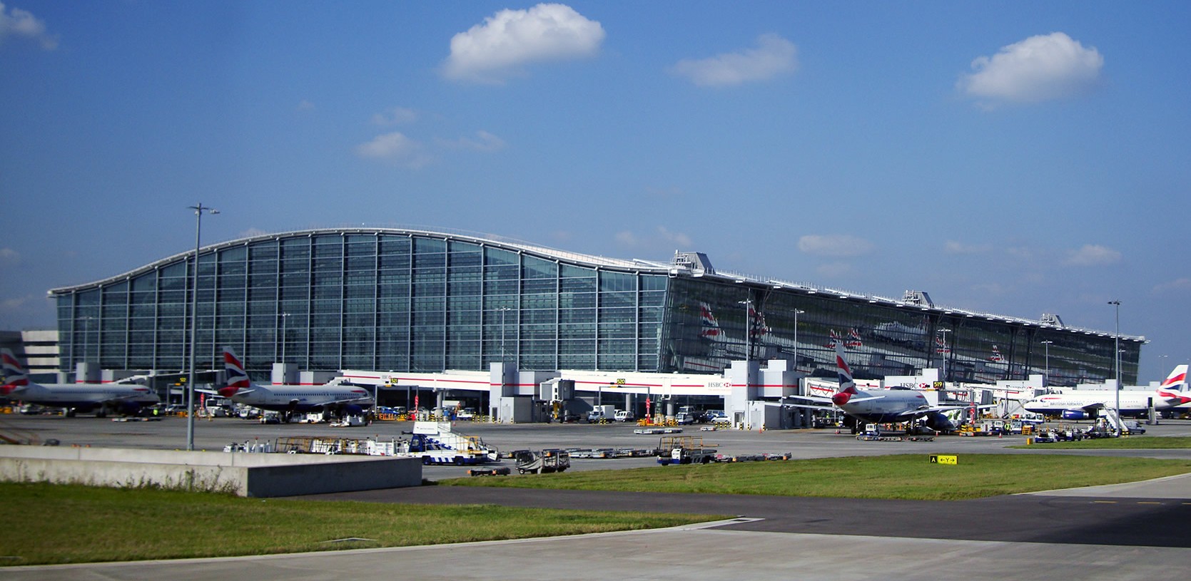Airport terminal exterior context for properties serving high-volume traveler corridors near major hubs.
