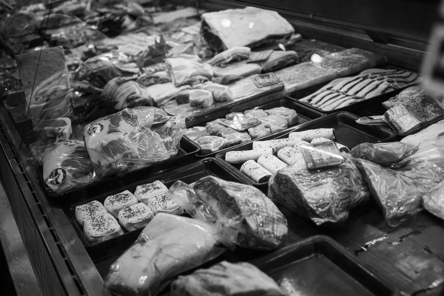 Packaged bacon cartons like those moving through an automated end of line cell.