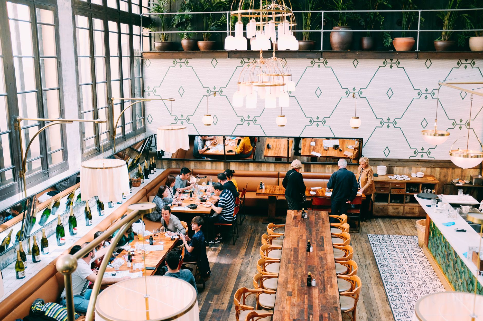 Rows of restaurant tables stretch across a wide dining floor.
