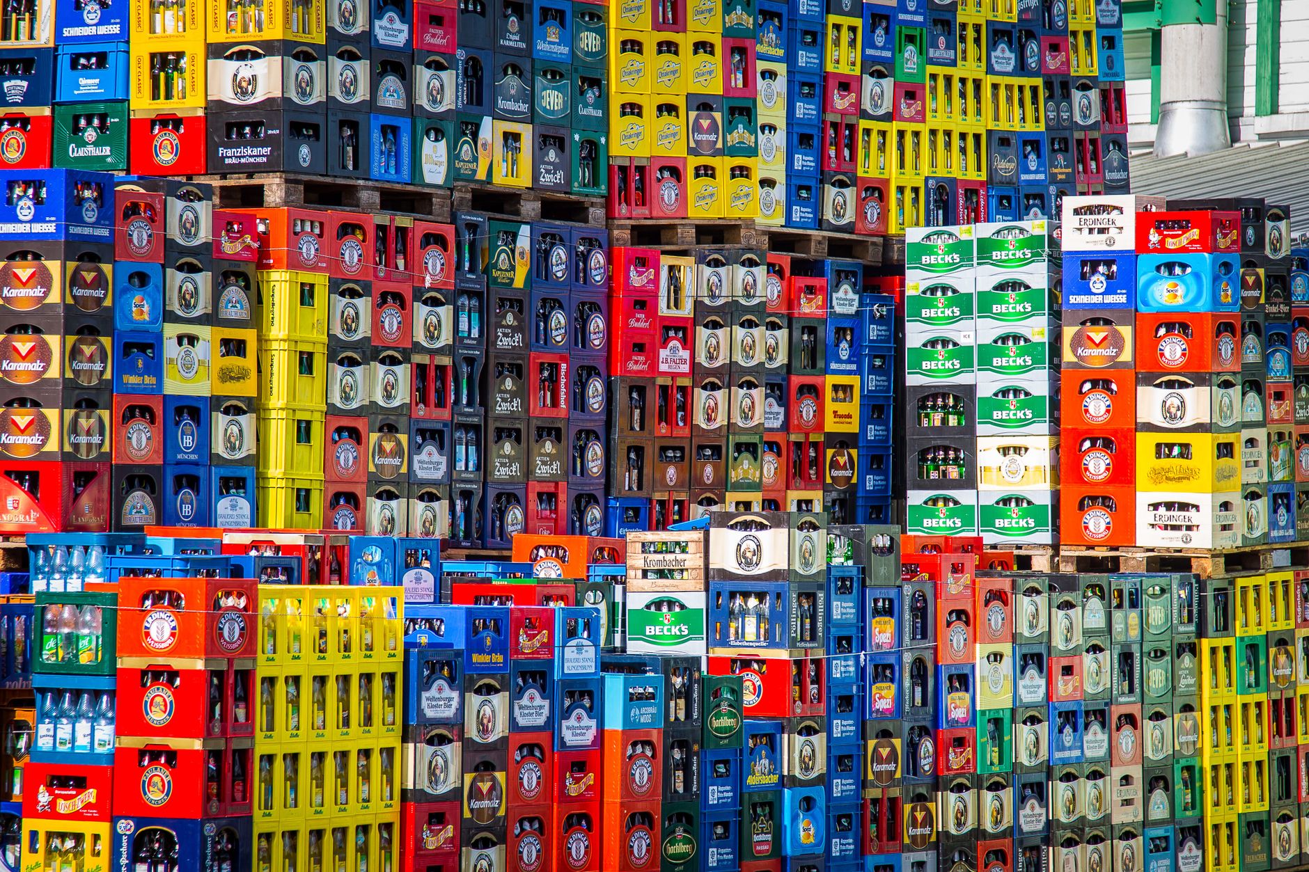 Cartons of bottled beverages staged for order fulfillment in a DC.